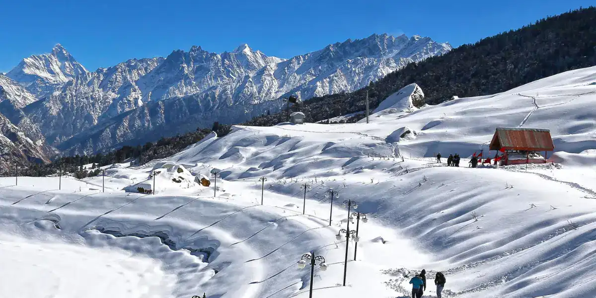 Snow-covered slopes and Himalayan peaks at Auli